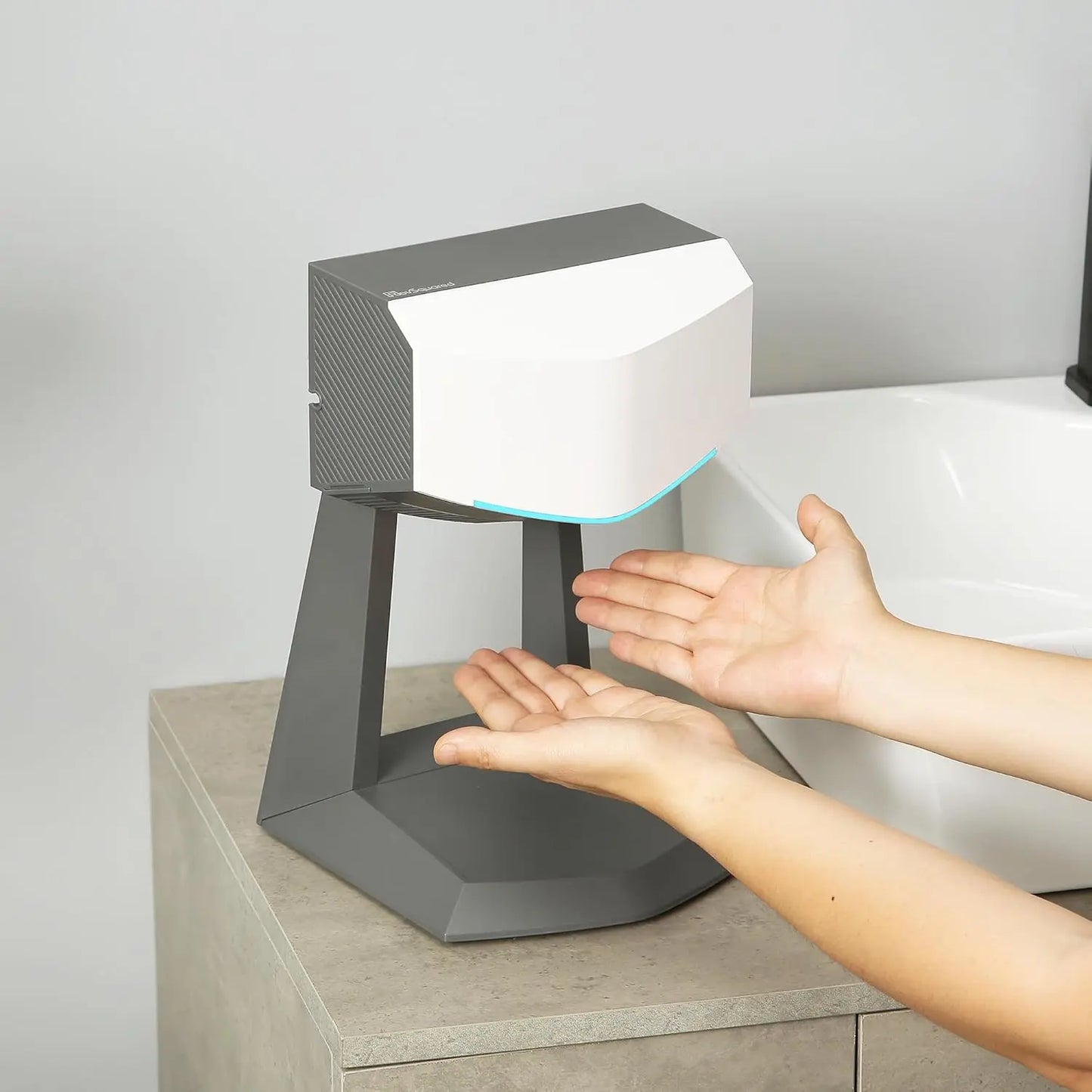 A hand dryer with an accessory stand and a HEPA filter
